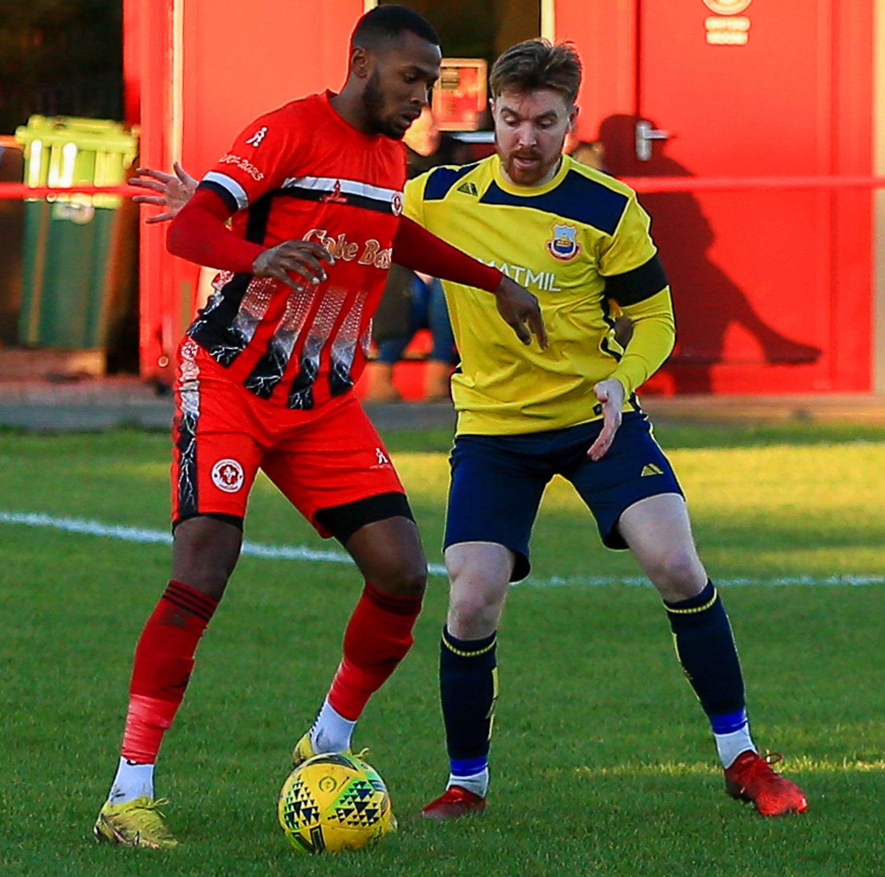 Jake Mackenzie up against a home player in Whitstable's goalless draw at Punjab United. Picture: Les Biggs