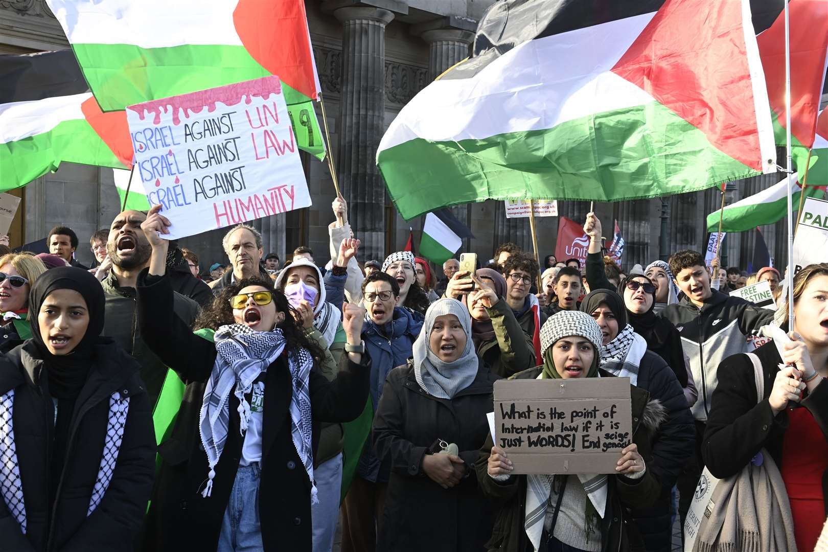 Demonstrators waved flags in Edinburgh (Lesley Martin/PA)