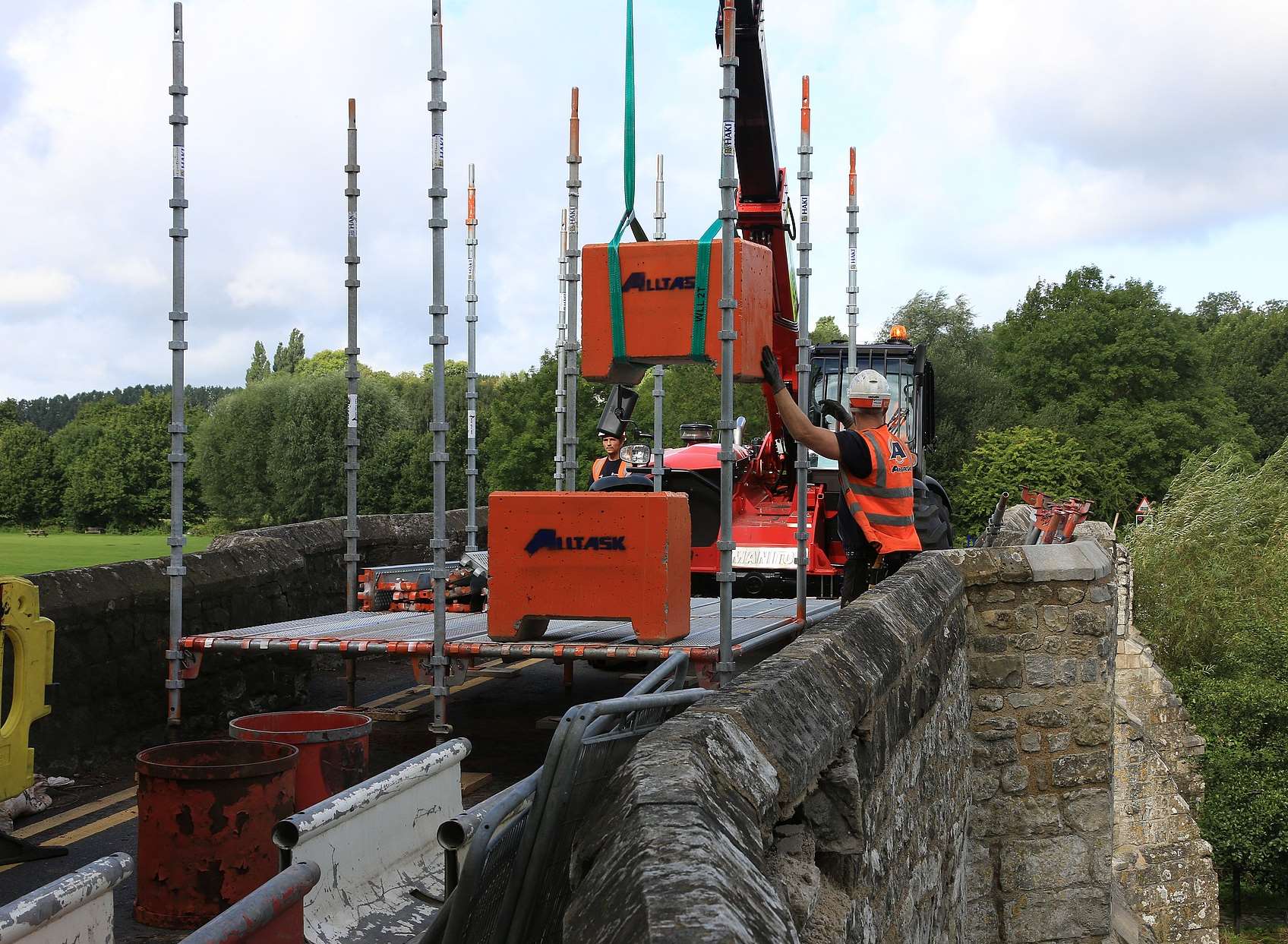 A scaffolding team building the cantilever walkway for builders to begin reconstruction of Teston Bridge. Picture: Mike Mahoney