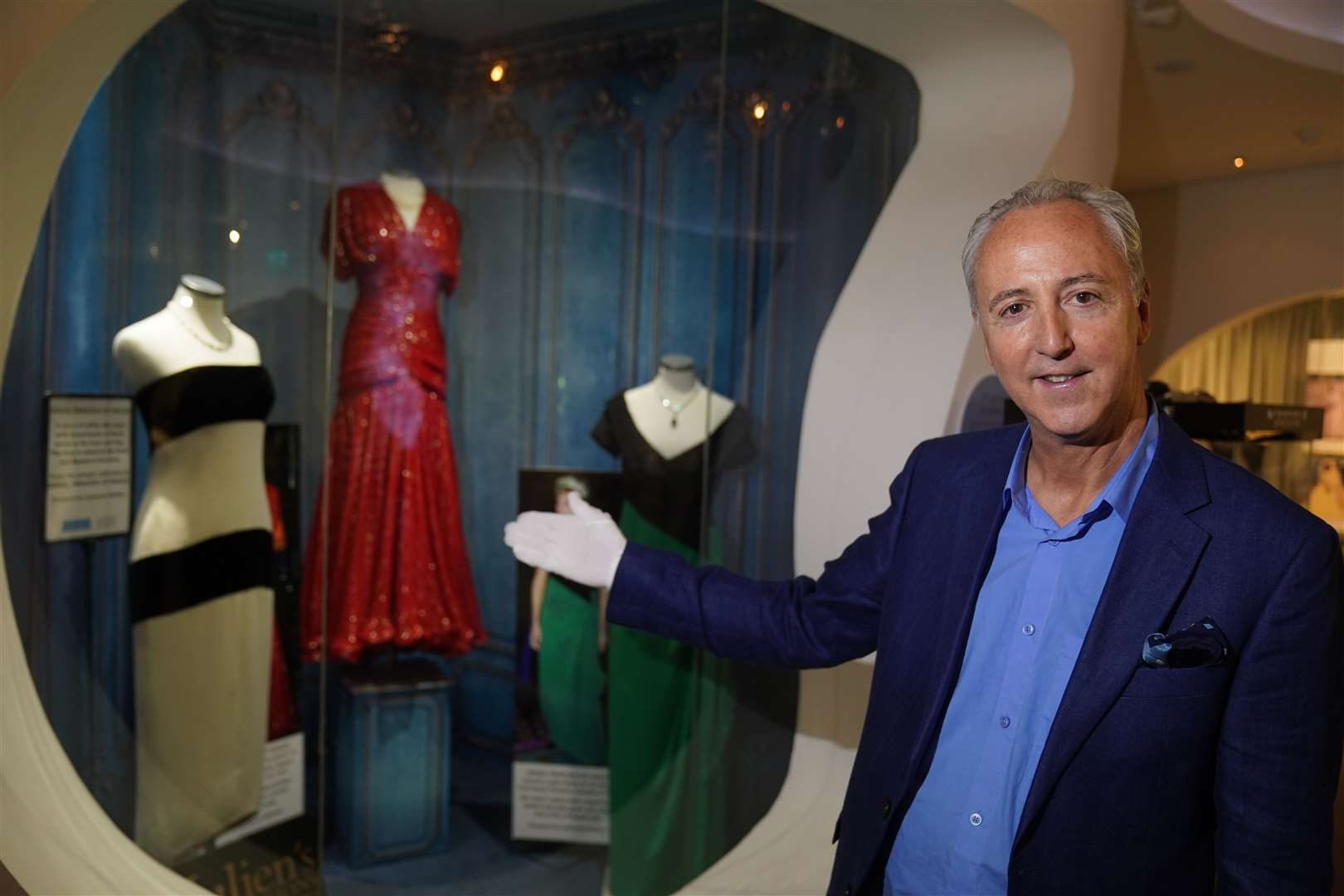 Director of Julien’s Auctions Martin Nolan with dresses owned by Diana on display in Co Kildare (Brian Lawless/PA)