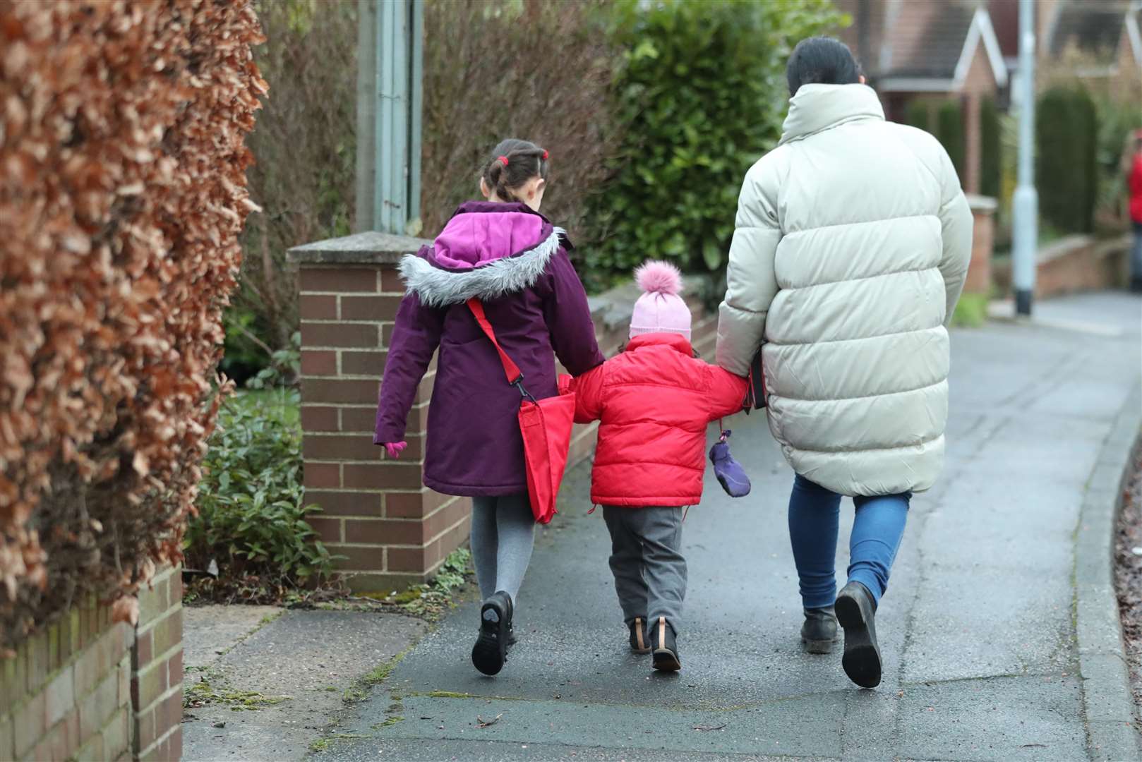 Children make their way to primary school in Leeds, Yorkshire, as schools across England return after the Christmas break (Danny Lawson/PA)