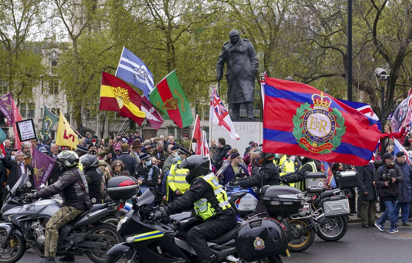 People taking part in a veterans march in Parliament Square (Steve Parsons/PA)