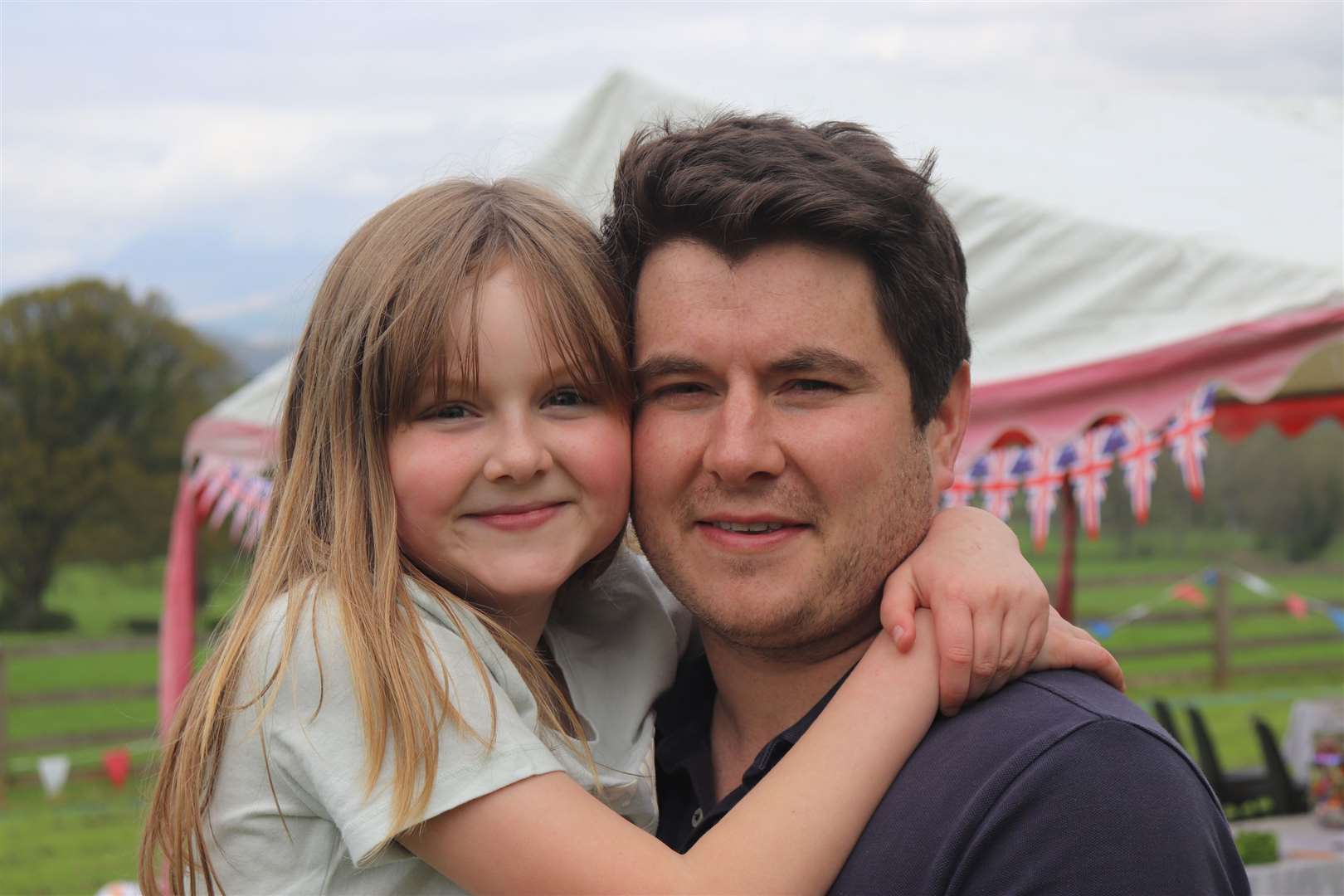 Tom Newall and his daughter Isla, 10, during a Coronation Big Lunch picnic at the Millennium Hall grounds in the village of Gartocharn on the banks of Loch Lomond (Handout/PA)