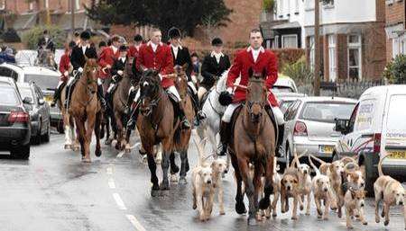 The scene in Elham as the East Foxhounds Hunt arrives in the High Street on Boxing Day.