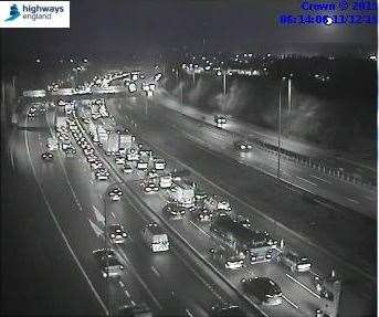 Traffic is queuing for miles on the M20 because of overrunning roadworks.