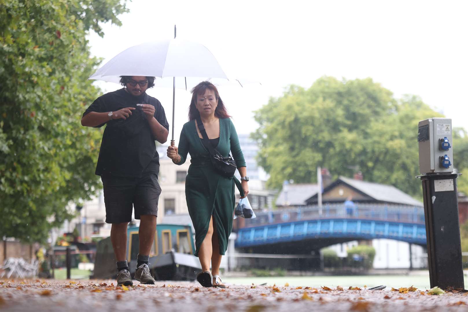 People walk alongside canals in Little Venice, west London (James Manning/PA)