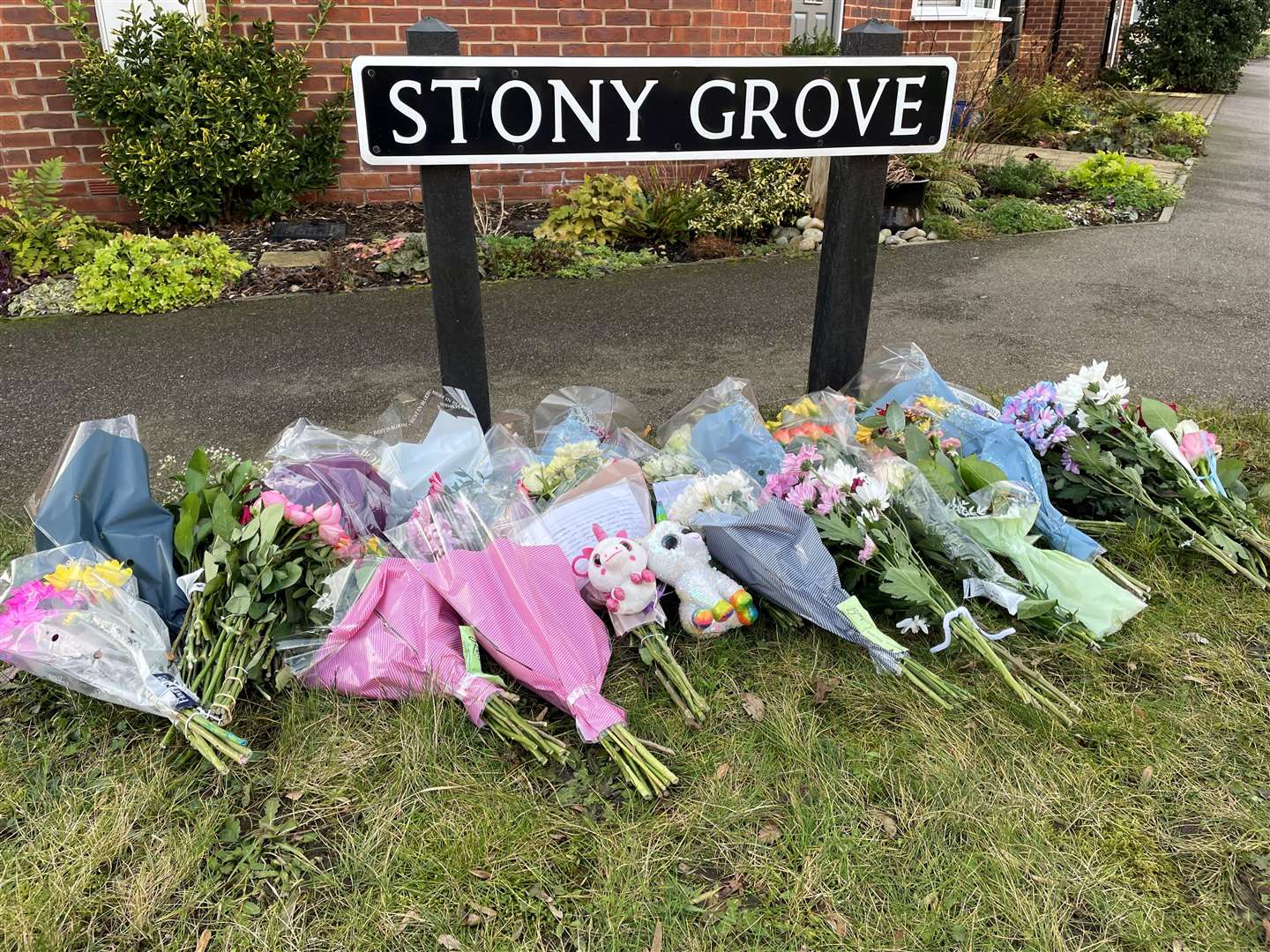 Floral tributes have been left at Stony Grove near to the house in Allan Bedford Crescent in Costessey, Norfolk (Sam Russell/PA)