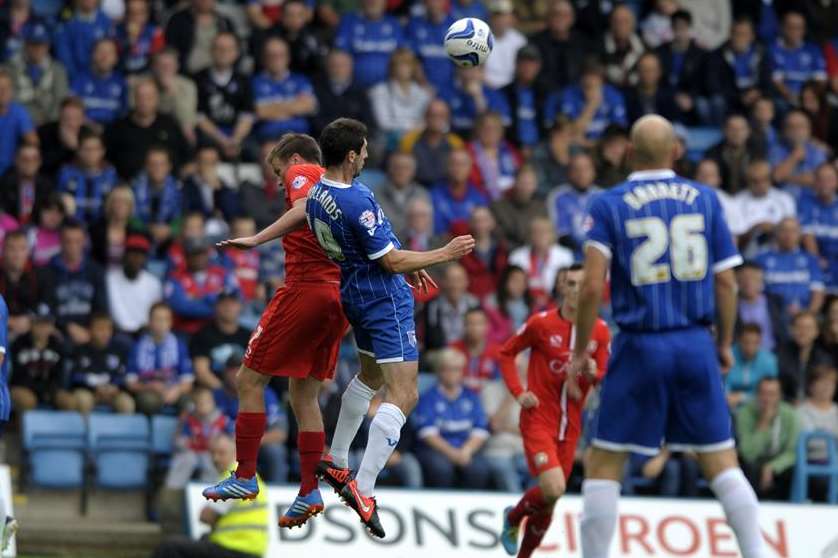 Danny Hollands battles to win possession against MK Dons on Saturday. Picture: Barry Goodwin