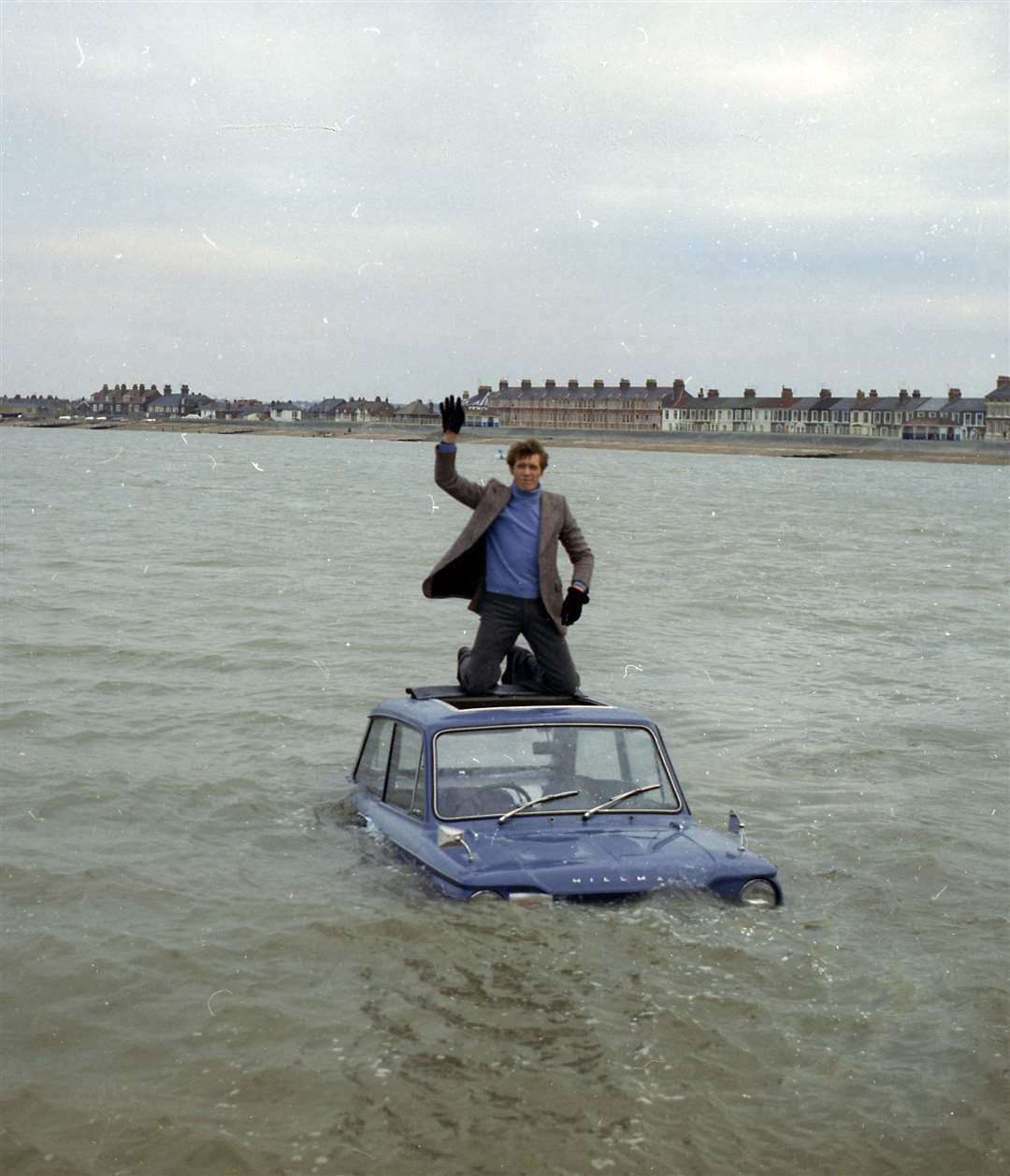 Michael Crawford waves to the crowd after filming the episode Learning To Drive on the seafront at Sheerness for the finale of the 1975 Christmas special of Some Mothers Do 'Ave 'Em. Picture: Barry Hollis