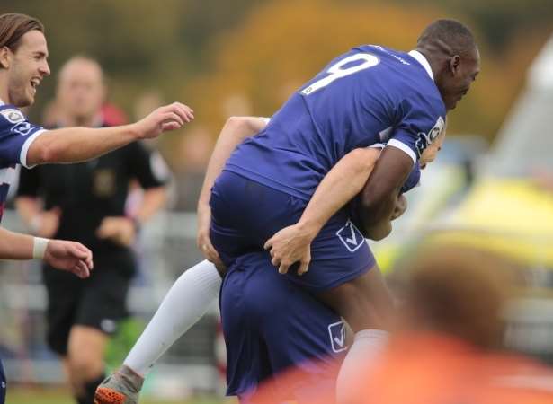 Margate's Freddie Ladapo congratulates goalscorer Luke Moore against Forest Green. Picture: Martin Apps