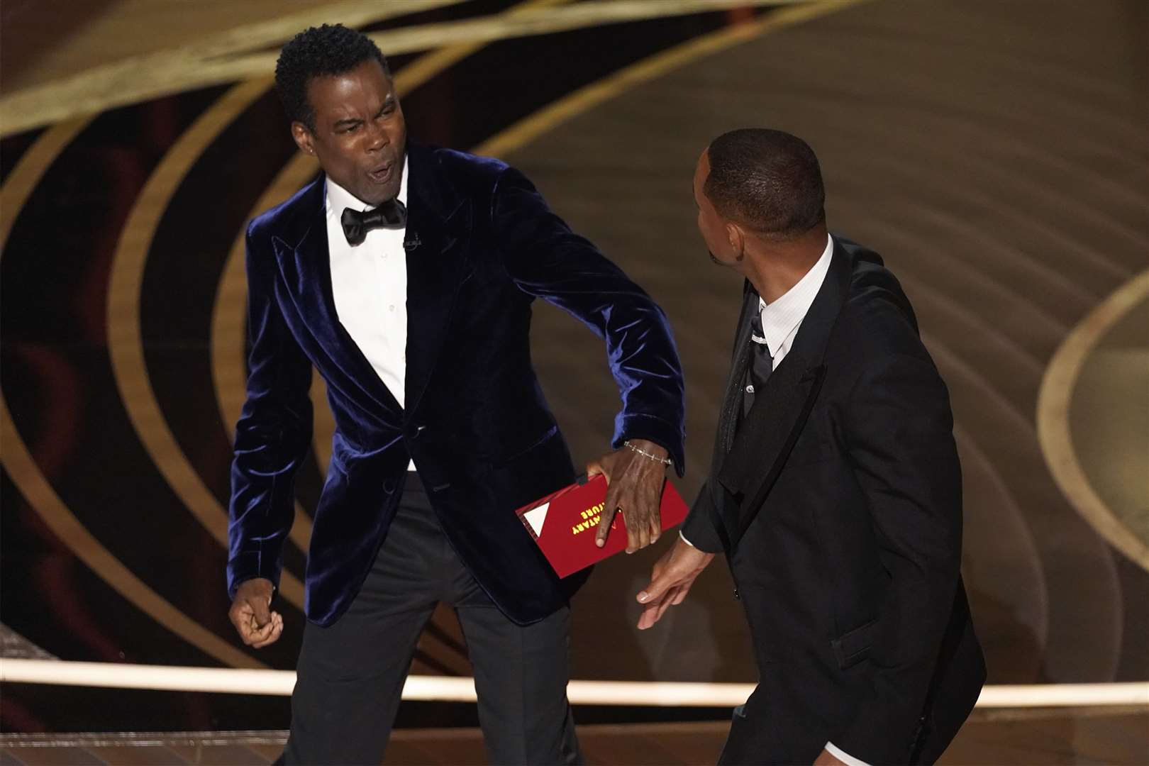 Chris Rock reacts after being hit by Will Smith (Chris Pizzello/AP)