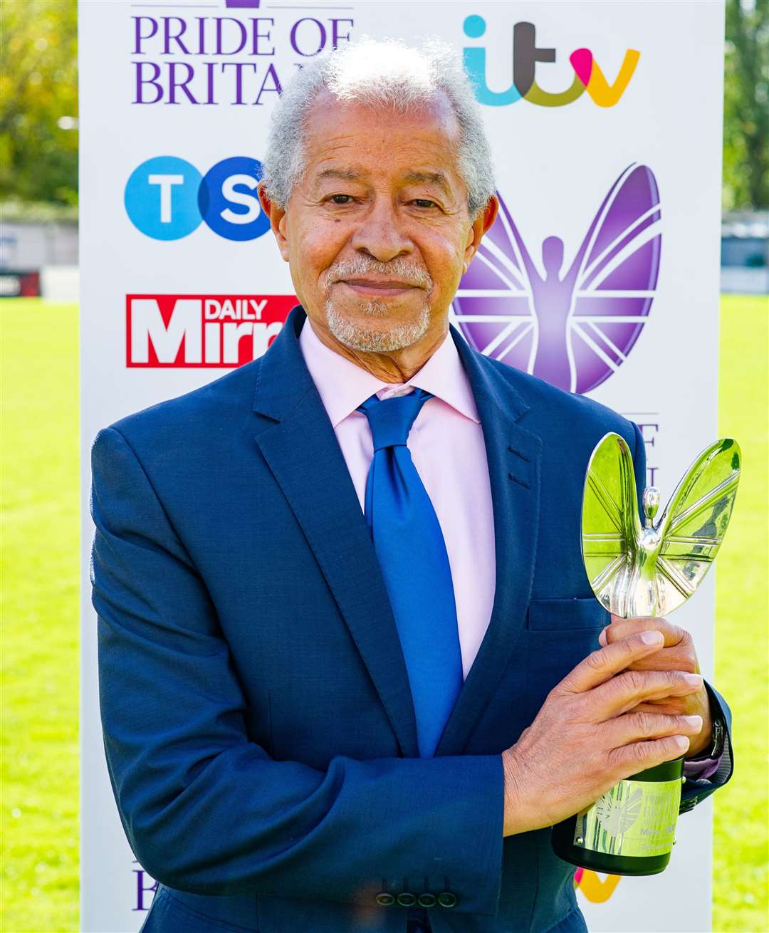 Sir Hermon Ouseley with his Pride of Britain award at the Dulwich hamlets footballer ground in London. Picture: Humphrey Nemar