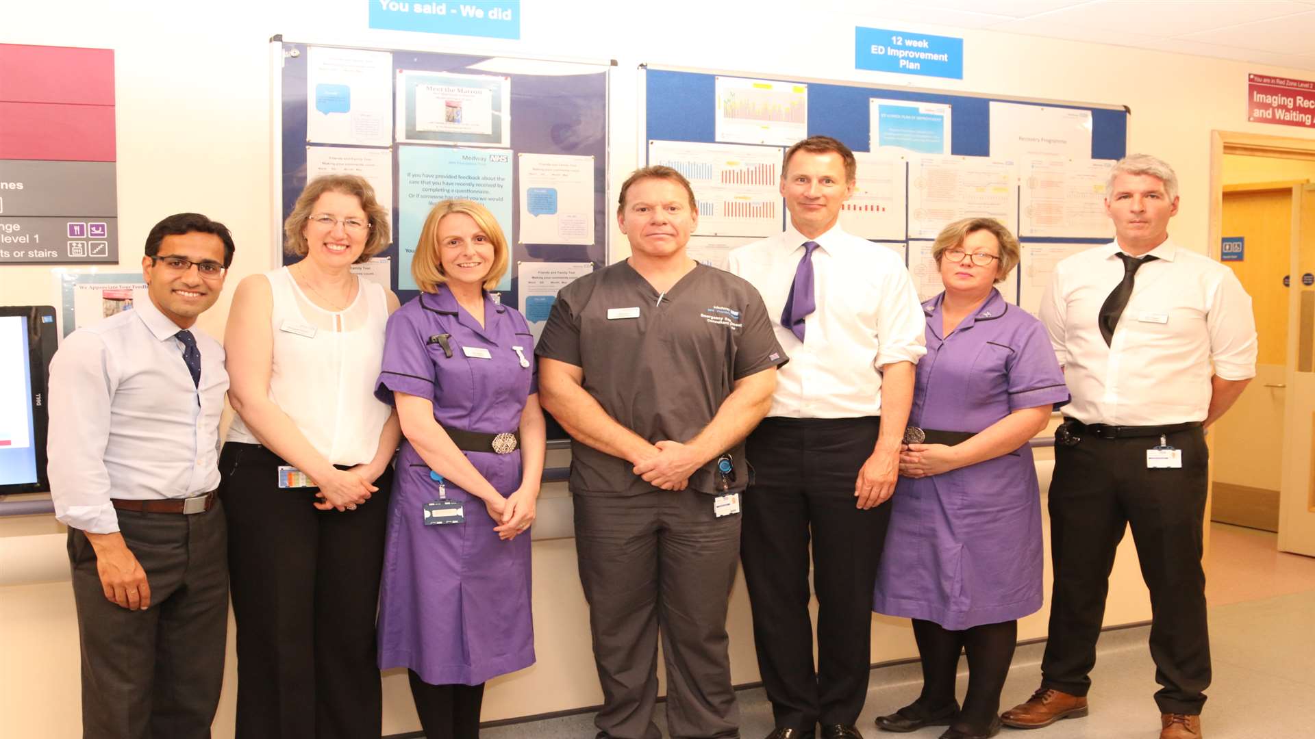 Health Secretary Jeremy Hunt with hospital staff and MP Rehman Chishti