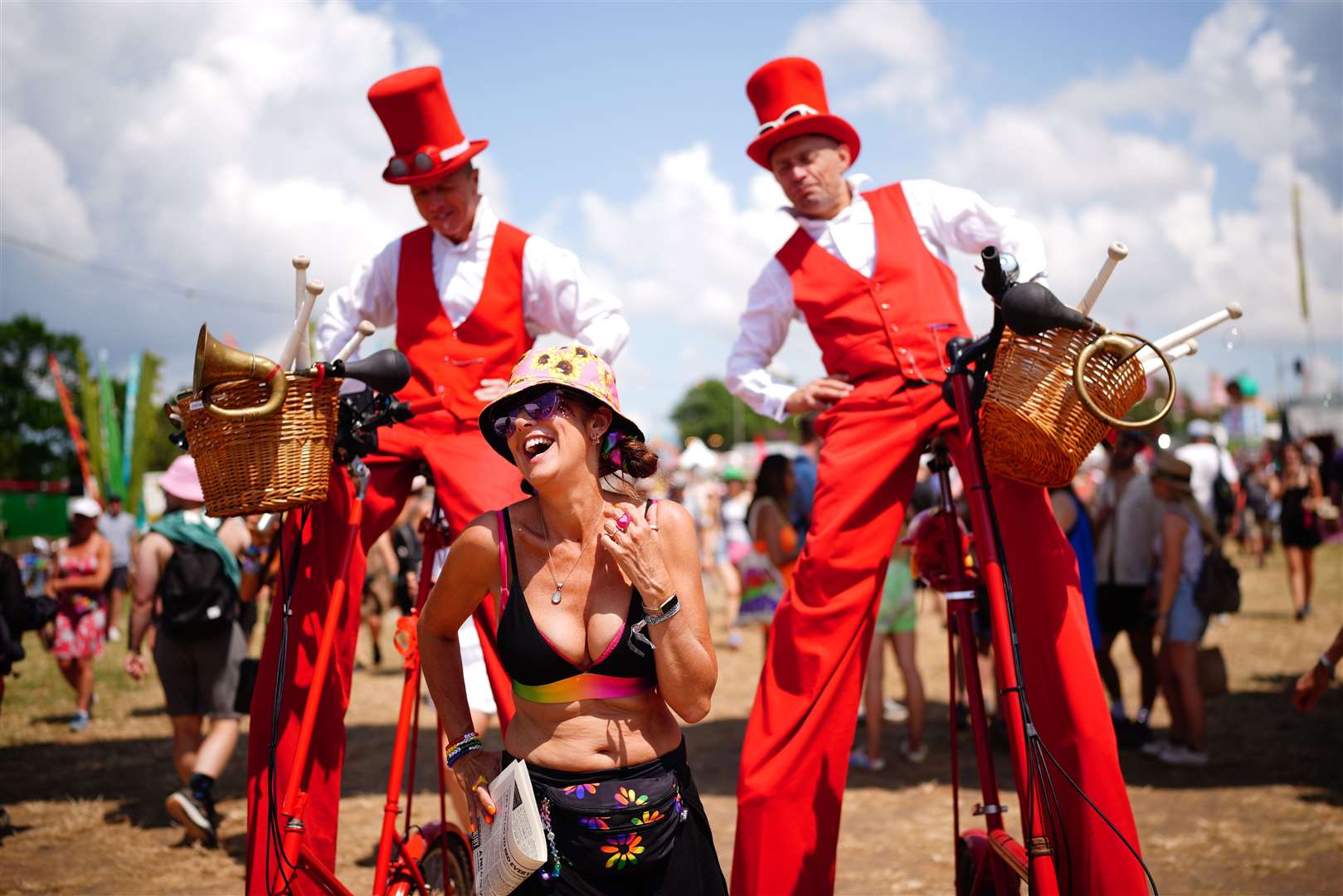 Stilt-walkers in the circus area of the festival (Ben Birchall/PA)