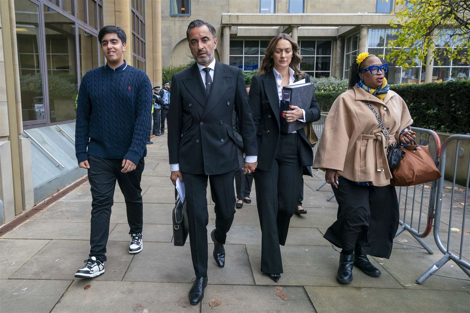 Solicitor Aamer Anwar (second left) arrives at Capital House, Edinburgh, for the inquiry (Jane Barlow/PA)