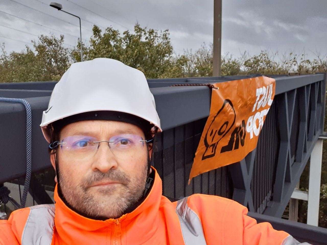 A Just Stop Oil protester on the M25