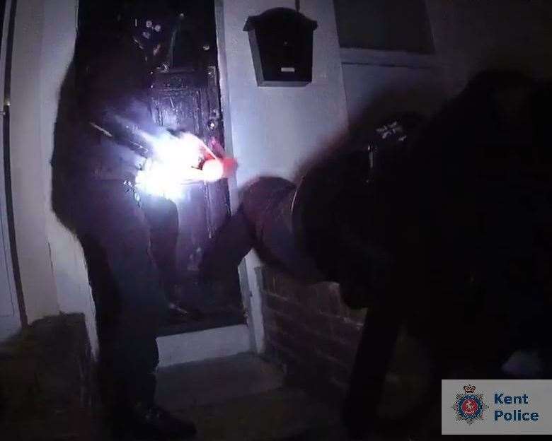 Officers in action in one of the raids. Picture: Kent Police