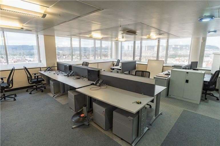 Filing cabinets, desks, telephones, desktop computers and chairs fill open planned offices in the former Saga building in Folkestone