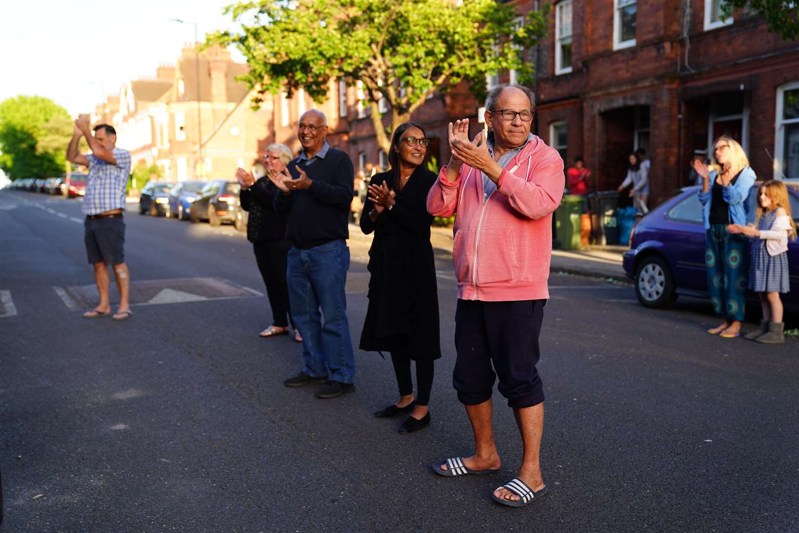 Neighbours of Annemarie Plas join in with the round of applause (Aaron Chown/PA)