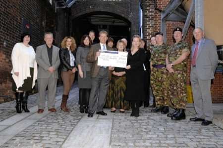 Jonathan Neame and Geraldine Allinson with the charity cheque and all involved in the event