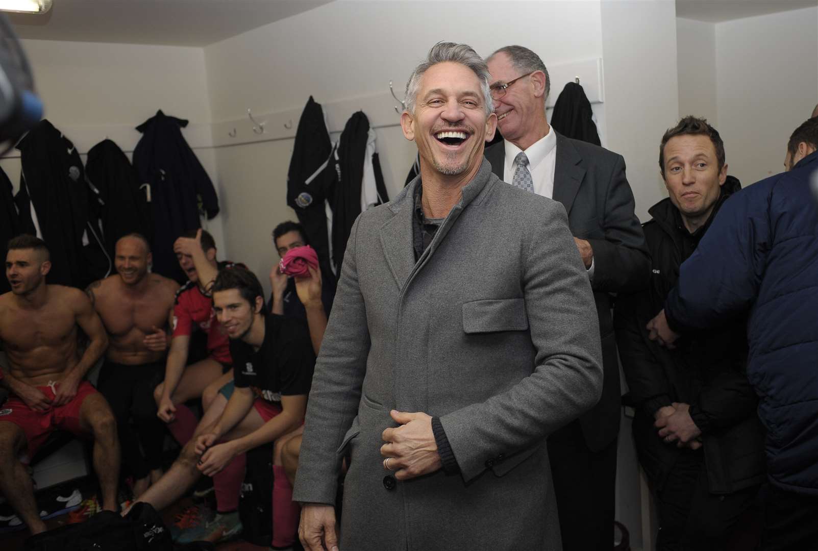 BBC TV's Gary Lineker finds the banter funny in the changing room after Dover's victory Cheltenham versus Dover