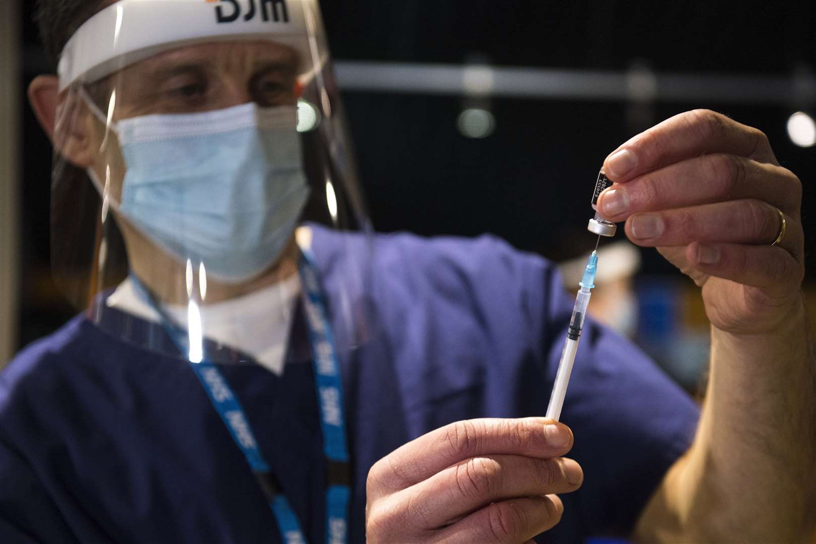 A nurse prepares the first of two injections with a dose of the Pfizer/BioNtech Covid-19 vaccine (Kirsty O’Connor/PA)