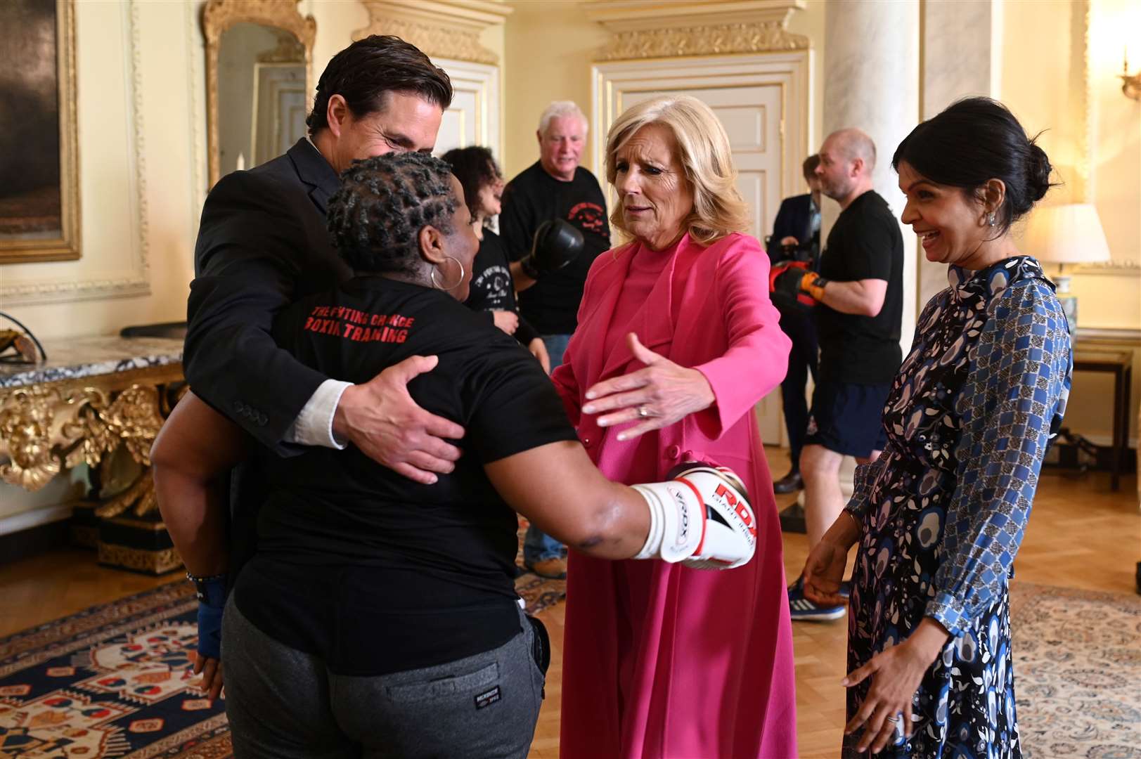 Johnny Mercer, Jill Biden and Akshata Murty with former lance corporal Maurillia Simpson (Oli Scarff/PA)