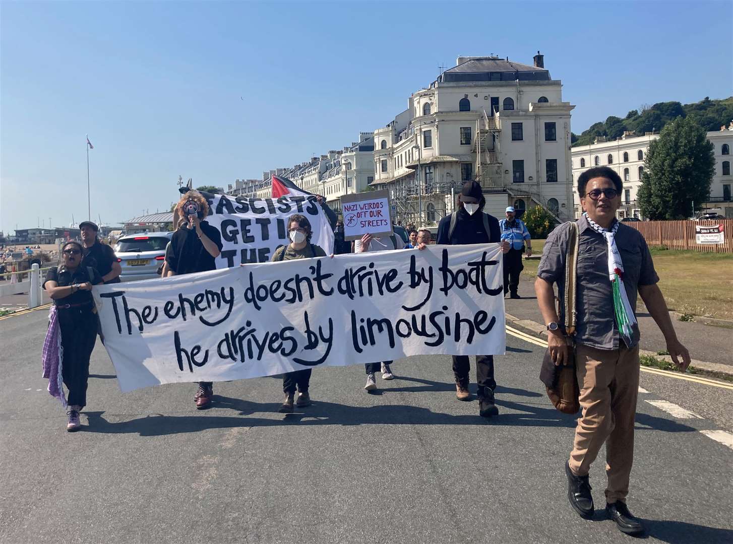 Pro-immigration groups marching along the seafront in Dover