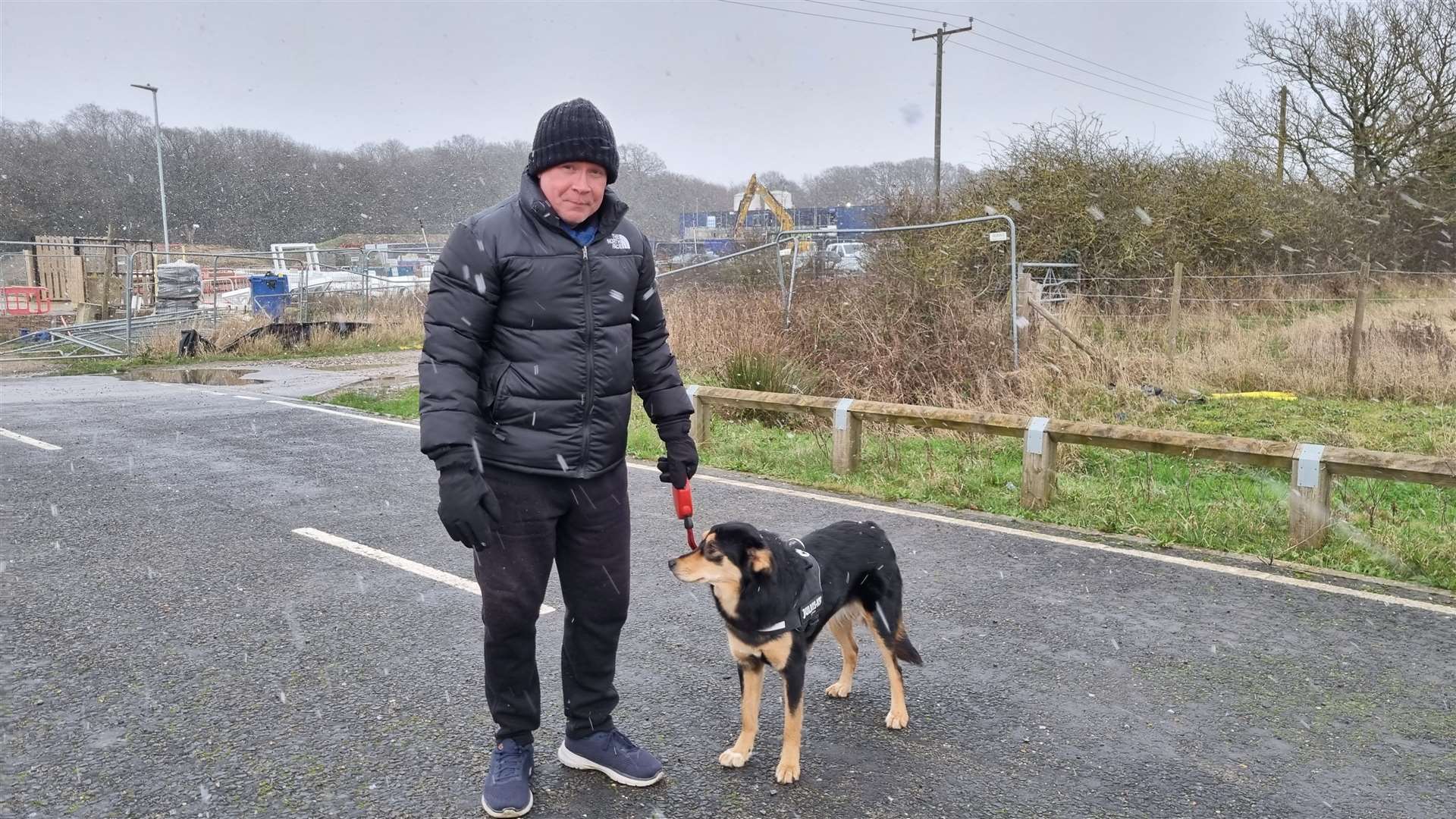 Mark Twomey from Bridgefield supports opening Rutledge Avenue, which connects Bridgefield and Finberry, to traffic. Mark pictured with dog Raya