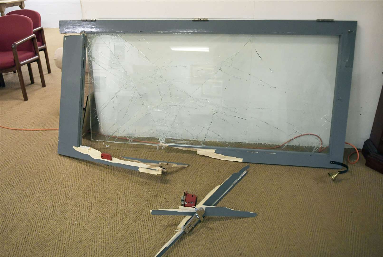 The front door to the shop was smashed by officers as they stormed the building. Picture: Barry Goodwin
