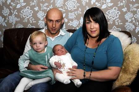 James and Maria, two-year-old Imogen and their Christmas present of a daughter Isobel