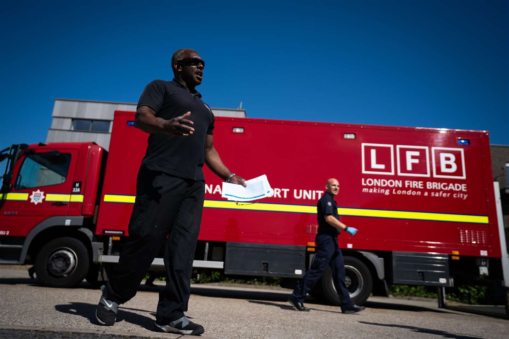 Mr Douglas (L) said tens of thousands of items of PPE were being distributed from south London every day (Aaron Chown/PA)