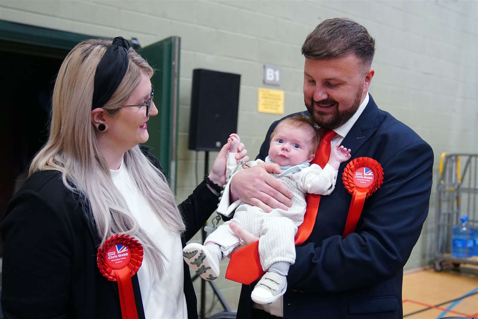 Labour candidate Chris Webb celebrates winning the Blackpool South by-election with his wife Portia and baby Cillian Douglas Webb (Peter Byrne/PA)