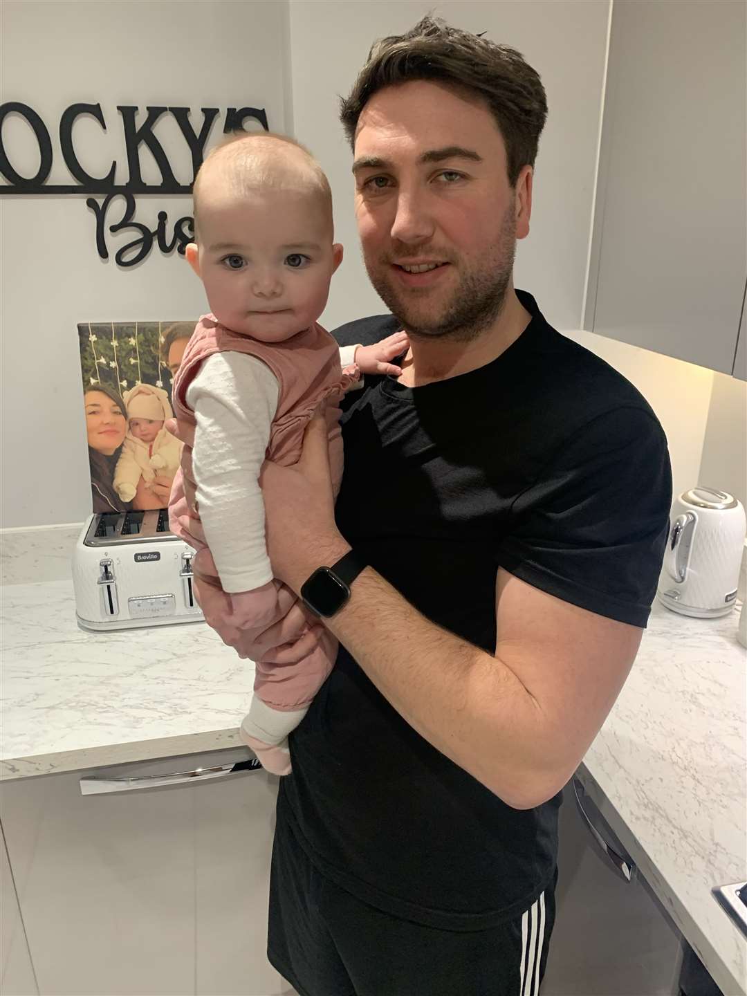 Jake Brockwell with his six-month-old daughter Elsie-Grace (Jake Brockwell/Macmillan/PA)