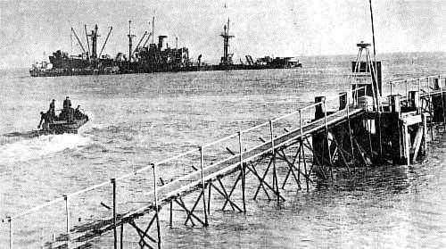 A wrecked ship between Deal's Pier and castle with a vessel heading towards it to continue the salvage operation