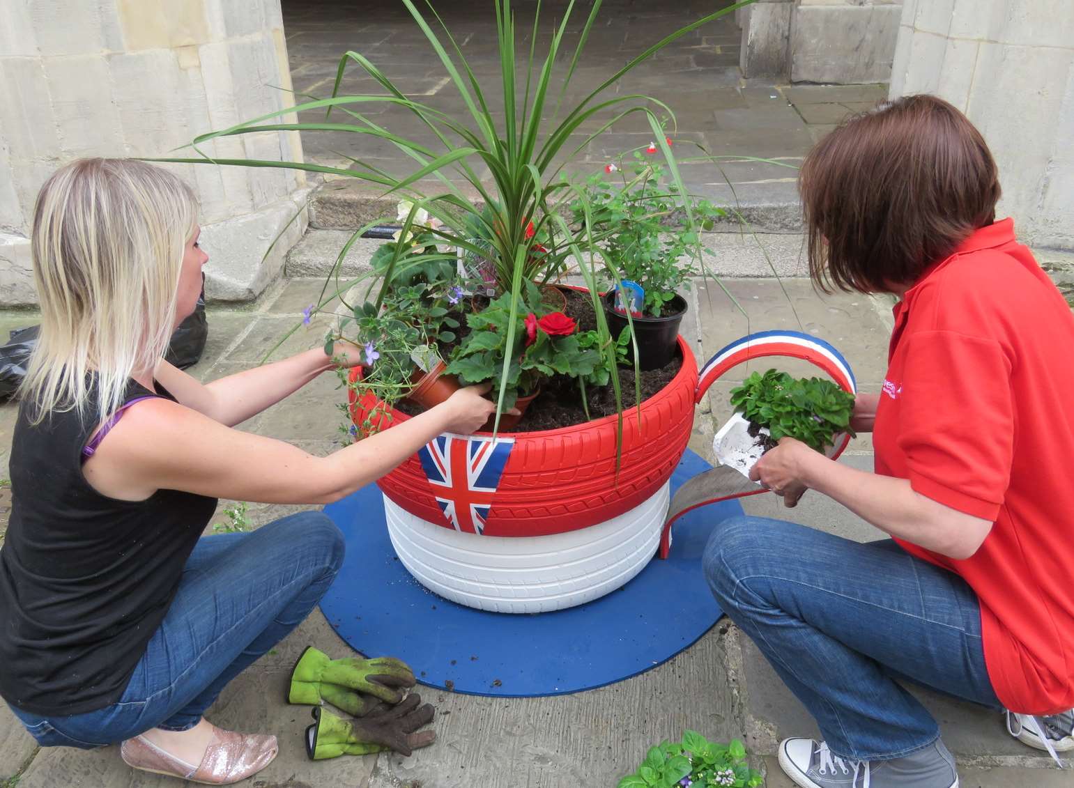 Volunteers plant the new tyre- teacups in Gravesend High Street.