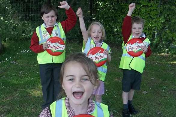 Mary-Tess, six, celebrates Challock School being named Mini Babybel Best Walking Bus for the Ashford area with Joseph, nine, Catriona, five and Thomas, five.