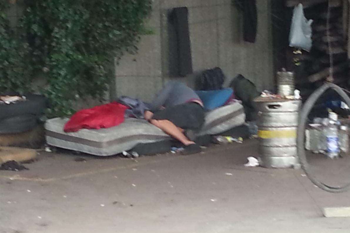 A man asleep in a disused agricultural building off Nackington Road