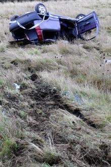 Grey Fiat Punto rolled from Brielle Way, between Queenborough Corner and the railway flyover, onto marshland on the Queenborough side of the road