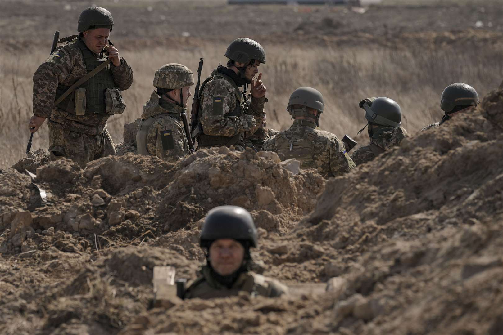 Ukrainian servicemen in trenches north of Kyiv (Vadim Ghirda/AP)