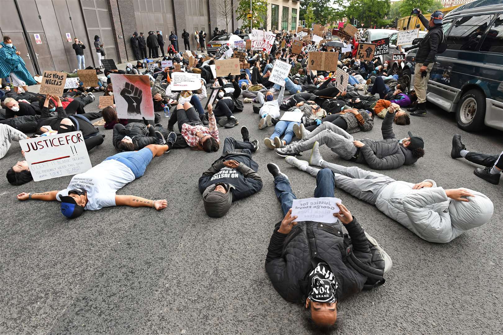 People take part in the protest rally at the US embassy (Stefan Rousseau/PA)