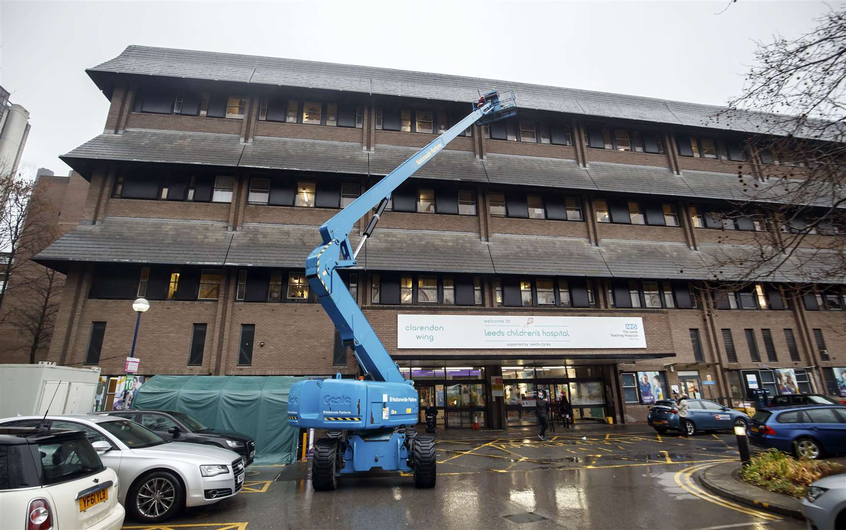 Santa Claus on a cherry picker outside Leeds Children’s Hospital in Yorkshire (Danny Lawson/PA)