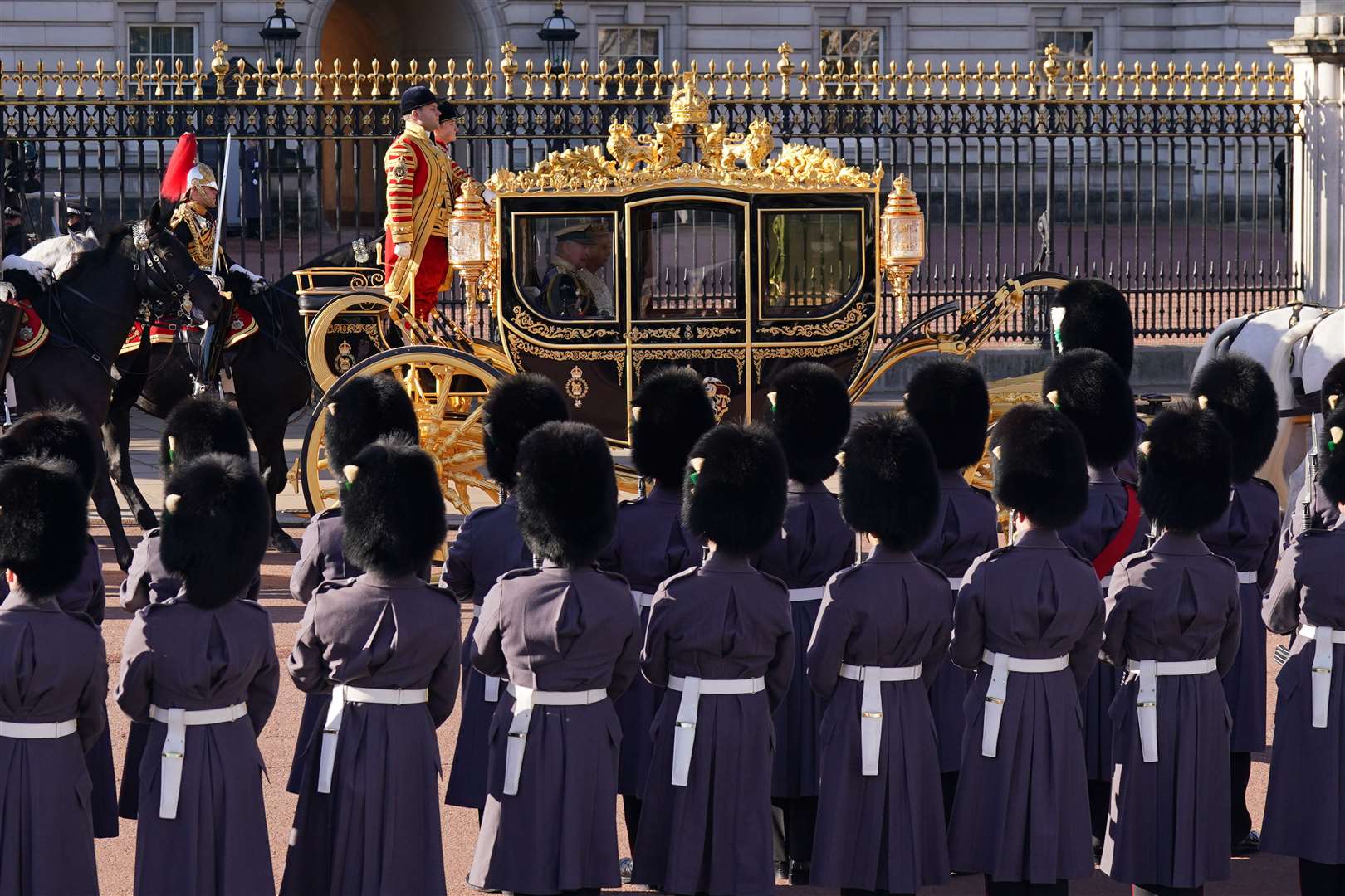 The King and Queen leaving Buckingham Palace ahead of the state opening of Parliament (Lucy North/PA)