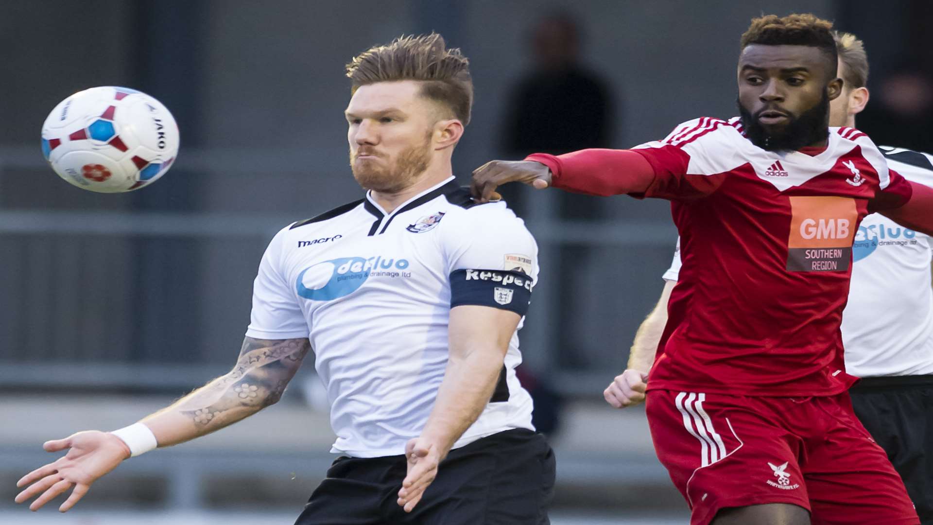 Dartford's Elliot Bradbrook collects the ball under pressure from Chris Sessegnon. Picture: Andy Payton