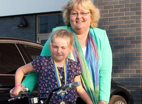 Fiona Trigwell with Malachi Campbell-Rolph who won first prize in the draw