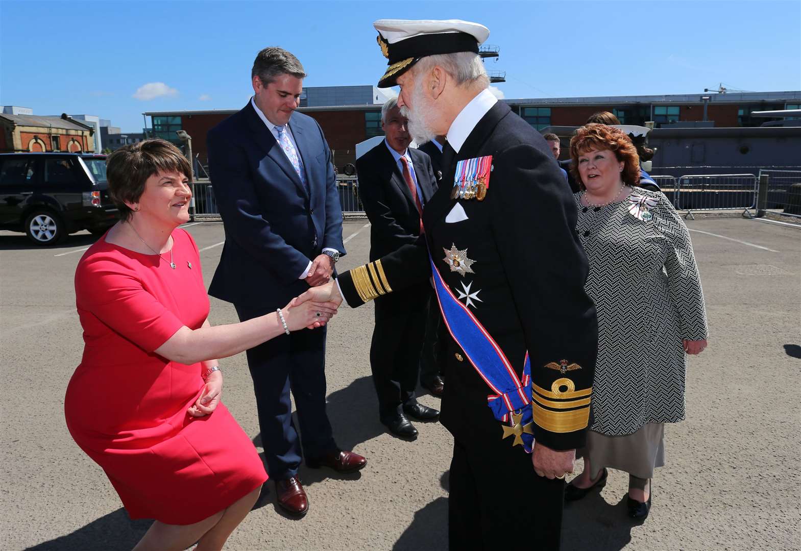 Northern Ireland First Minister Arlene Foster greets Prince Michael of Kent as a 2016 ceremony at the HMS Caroline to commemorate the Battle of Jutland centenary (PA)