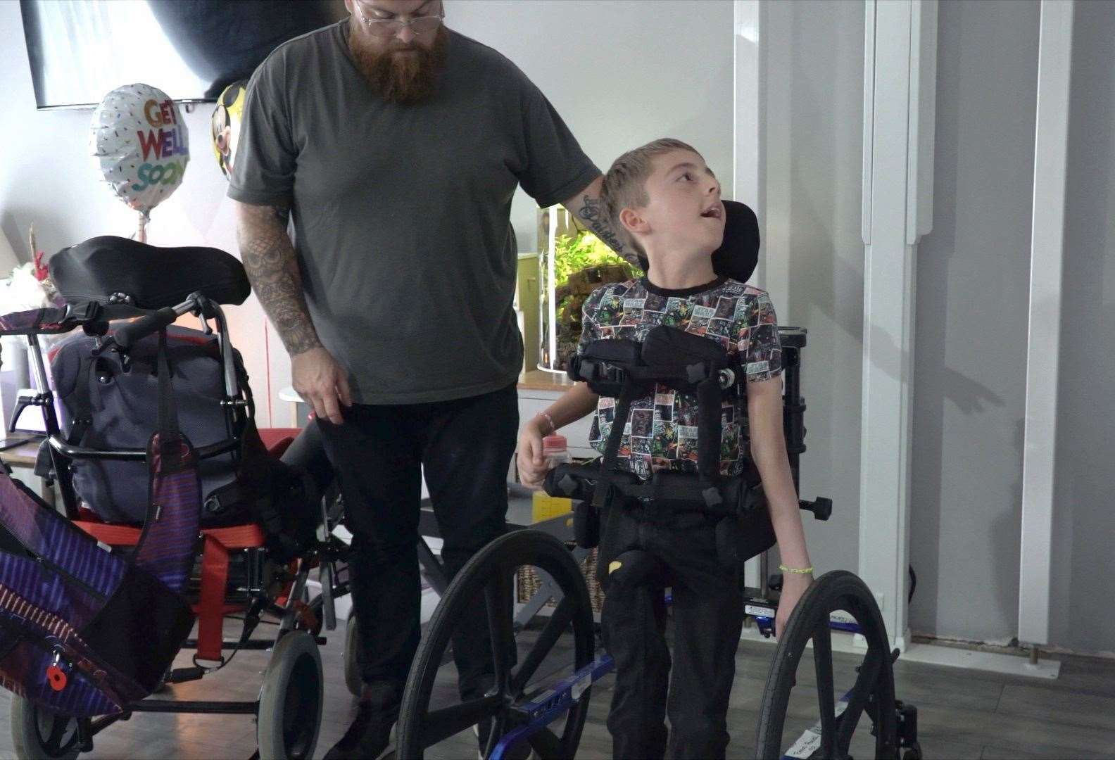 Tomas has outgrown his current walker, and the headrest cannot properly support his head and his arms risk getting caught in the spokes of the wheels