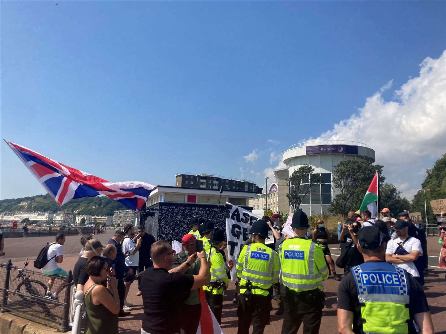 Police form a line between pro- and anti-immigration groups during protests in Dover