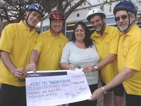 Alex Fortescue, Simon Slinn with Charles Getliffe and Ray Loft present cheque to Christine Lux of the MS Therapy Centre. Picture: Chris Davey