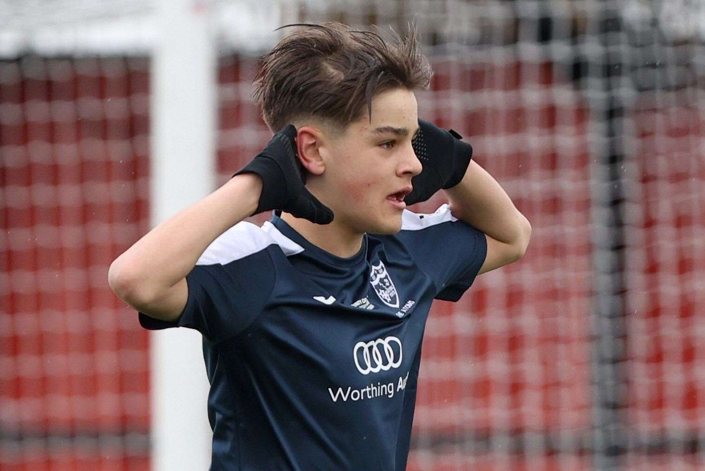 AJ Whiteman celebrates one of his five goals for AFC Worthing under-13s against Ebbsfleet. Picture: PSP Images